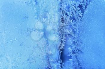 Beautiful ice pattern texture on winter glass