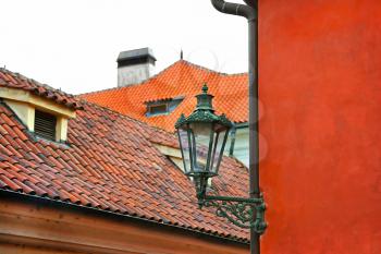 Traditional street lamp and the tiled roofs of Prague, Czech Republic