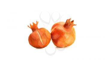 Two pomegranate fruits on white background