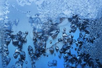 Natural ice pattern on winter glass, closeup texture