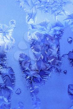 Ice pattern on winter window glass, natural texture