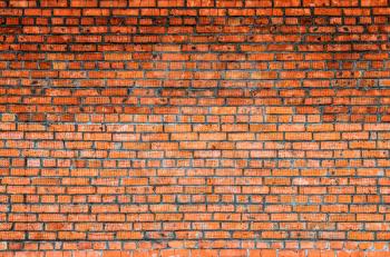 Red brick wall, close-up grunge texture