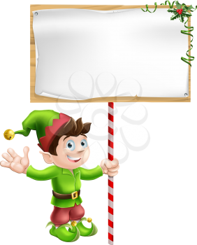 A Christmas elf or pixie or Santa's helper holding a large Christmas sign in traditional elf clothes