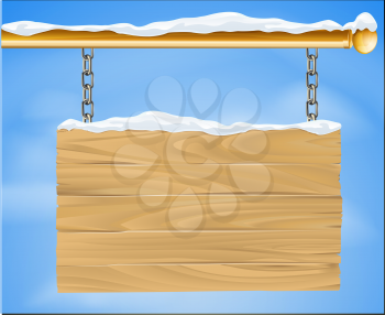 A rustic wooden snow covered winter Christmas sign hanging suspended from a brass metal pole with the blue sky in the background