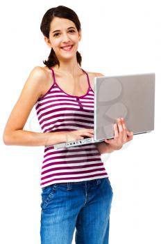 Royalty Free Photo of a young Girl Holding a Laptop Posing for the Camera