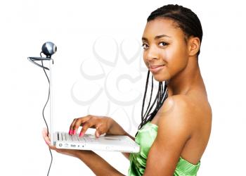 Royalty Free Photo of a Beautiful Young Girl Using a Laptop Computer