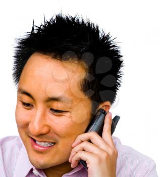 Royalty Free Photo of an Asian Man Talking on a Cell Phone 