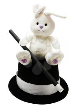 Royalty Free Photo of a Stuffed Rabbit Holding a Wand Sitting on a Tophat 