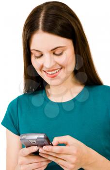 Royalty Free Photo of a Woman Texting on her Cellular Phone and Smiling