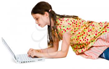 Caucasian girl using a laptop isolated over white