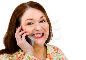 Royalty Free Photo of a Mature Women Smiling and Talking on her Cell Phone