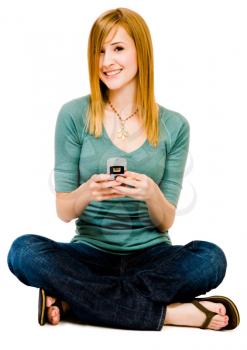 Royalty Free Photo of a Woman Sitting Down Texting on her Cell Phone