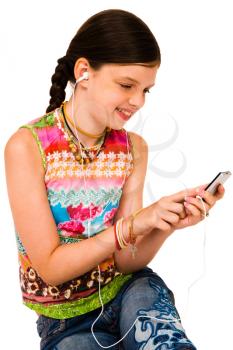Royalty Free Photo of a Girl Listening to Music on her Mp3 Player