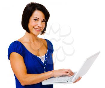 Royalty Free Photo of a Woman Standing and Smiling Holding a Laptop