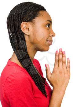 Royalty Free Photo of Young Woman Praying with her Eyes Open