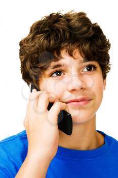 Royalty Free Photo of a Young Boy Talking on a Cell Phone