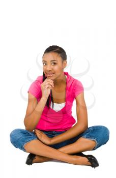 Royalty Free Photo of a Teenager Girl Sitting on the Floor Cross Legged