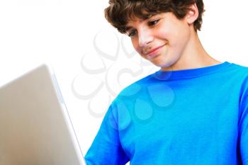 Royalty Free Photo of a Teenage Boy on his Laptop