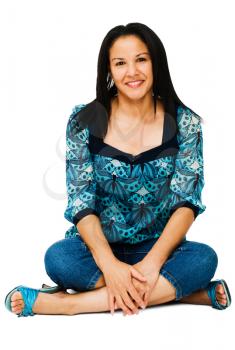 Royalty Free Photo of a Woman Sitting on the Floor Smiling