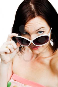 Royalty Free Photo of a Woman Tipping her Sunglasses