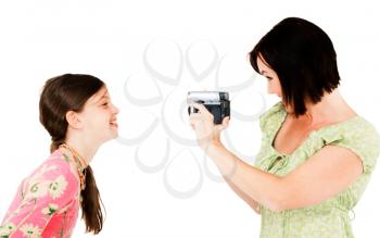 Royalty Free Photo of a Woman Filming a Young Girl