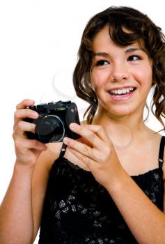 Royalty Free Photo of a Teenage Girl Taking Photographs