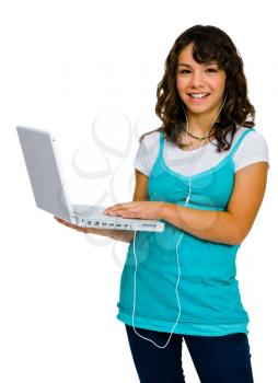 Royalty Free Photo of a Teenager Listening to Music Through her Laptop