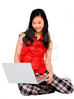 Royalty Free Photo of a Woman Sitting on the Floor Using her Laptop