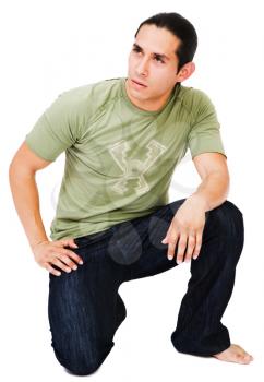 Royalty Free Photo of a Male Model Kneeling Down on One Knee