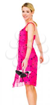 Royalty Free Photo of a  Woman Holding her High Heels and Smiling