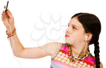 Royalty Free Photo of a Young Girl Listening to Music on an Mp3 Player