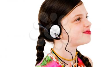 Royalty Free Photo of a Young Girl Listening to Music on Headphones