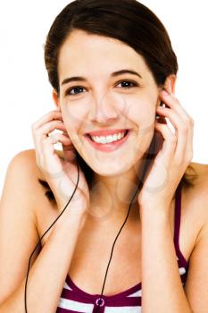 Royalty Free Photo of a Woman Listening to Music with Earbuds