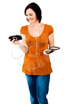 Royalty Free Photo of a Woman Listening to Music on a Media Player