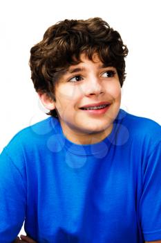 Boy day dreaming and smiling isolated over white