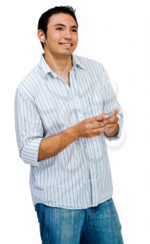 Man listening to music on a MP3 player and smiling isolated over white
