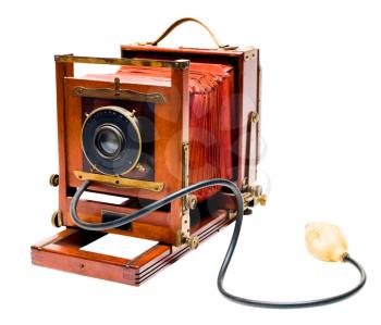 Old camera of red color isolated over white