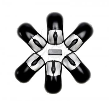 Asterisk made of computer key and computer mouses isolated over white