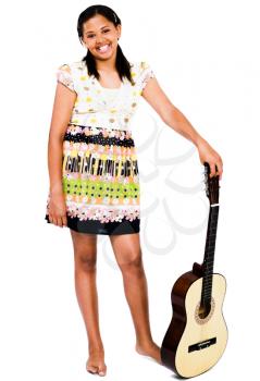 Smiling teenage girl holding a guitar isolated over white