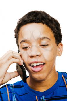 Teenage boy using a mobile phone isolated over white