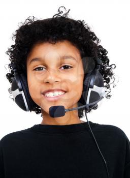 Happy boy wearing a headset isolated over white