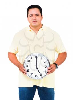 Man holding a clock isolated over white