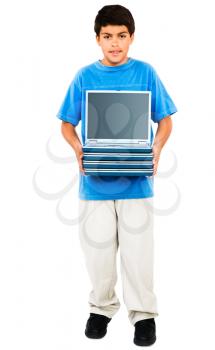 Portrait of a boy holding a stack of laptops isolated over white