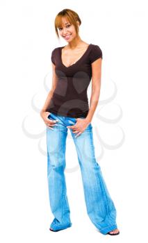 Smiling young woman standing isolated over white
