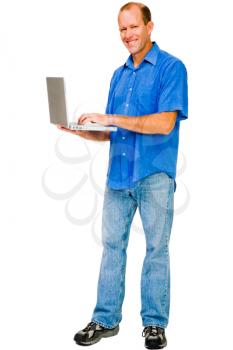 Portrait of a man using a laptop and smiling isolated over white