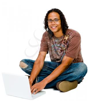 Man using a laptop and smiling isolated over white