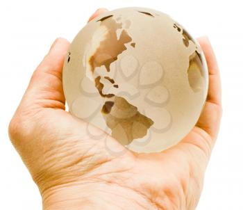Human hand holding a globe isolated over white