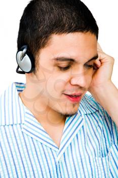 Man listening to headphones isolated over white