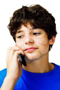 Close-up of a boy talking on a mobile phone isolated over white