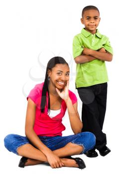 Portrait of a teenage girl smiling with a boy isolated over white